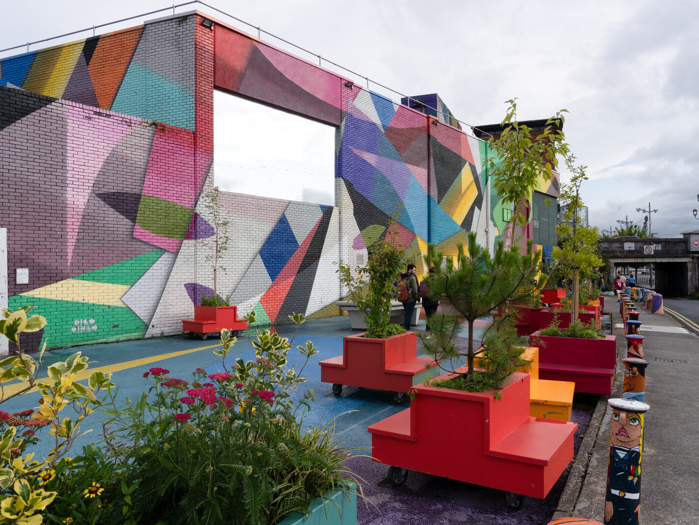 Overview of the Honan's Quay mural by Digo Diego, showcasing its organic forms and vibrant palette, designed to enhance and revitalise the city space