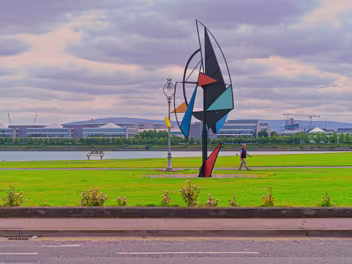 WIND SAIL SCULPTURE As you stroll along the promenade, you'll encounter the striking "Wind Sail Sculpture", created by Derry-born artist...