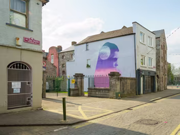 STRENGTH IN FRAGILITY The Mural: EMIC's mural is a vibrant and poignant depiction of hope and solidarity. It portrays individuals supporting...