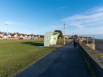 THE WIND SHELETER THE WIND SHELTERS AND THE BANDSTAND ALONG CLONTARF PROMENADE [REMAIN AS A TRIBUTE TO HERBERT SIMMS]