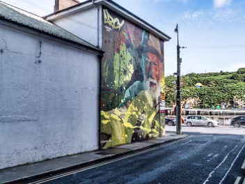 THE FISHERMAN MURAL ON GRATTAN QUAY Ryan Christenson, a Connecticut native, began his artistic journey at a young age. While working in his father's...