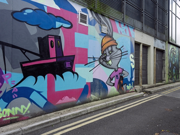 BUGS BUNNY MURAL Explore the vibrant Bugs Bunny and tugboat mural by Irish street artists ADRE and Sonny at Glasshouse Lane, Waterford. A...