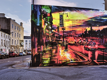 THE WATERFORD QUAYS Photograph and architectural review of Dan Kitchener's cinematic mural 'The Quays' on Rose Lane, Waterford. Explores the...