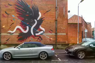 EXAMPLES OF STREET ART BY DANK AND SABEK [ON THE RED BRICK WALL ON TALBOT STREET IN BELFAST]-235444-1 MURAL ON TALBOT STREET