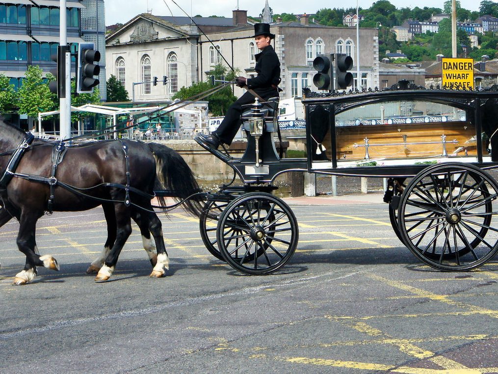 HORSE-DRAWN HEARSE IN CORK [DOES THE PRIEST DO A GOOD MASS AND A LOVELY FUNERAL]