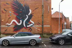 EXAMPLES OF STREET ART BY DANK AND SABEK [ON THE RED BRICK WALL ON TALBOT STREET IN BELFAST]-235444-1 MURAL ON TALBOT STREET