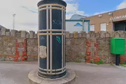 A FREESTANDING FINIAL-TOPPED CAST-IRON TRANSFORMER [DATING FROM 1900 AND LOCATED AT CONQUER HILL ROAD NEAR CLONTARF BUS GARAGE]-244412-1