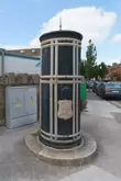 A FREESTANDING FINIAL-TOPPED CAST-IRON TRANSFORMER [DATING FROM 1900 AND LOCATED AT CONQUER HILL ROAD NEAR CLONTARF BUS GARAGE]-244414-1