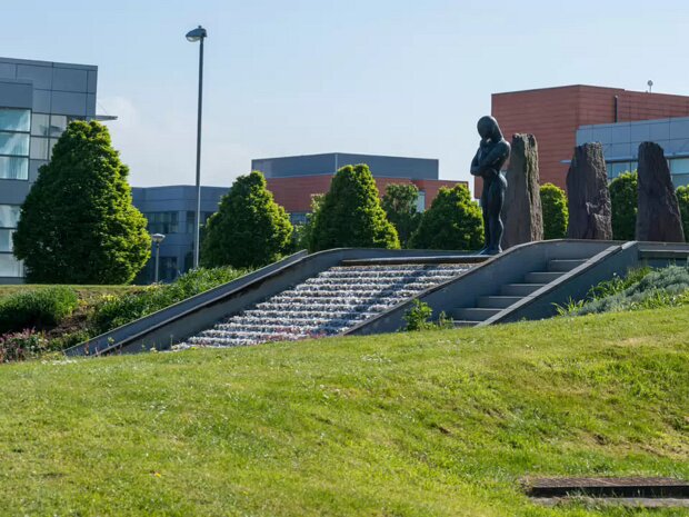 SCULPTURE BY ORLA DE BRI This striking sculpture, "The Bastard Son of Sisyphus", by Orla de Brí, is located in Park West, Dublin. It offers a...