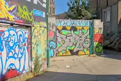 ST PETERS LANE IN PHIBSBOROUGH [BACK IN JULY 2022 IT HOSTED SOME MURALS BUT THE QUALITY WAS IN DECLINE]-244054-1