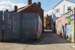 ST PETERS LANE IN PHIBSBOROUGH [BACK IN JULY 2022 IT HOSTED SOME MURALS BUT THE QUALITY WAS IN DECLINE]-244060-1