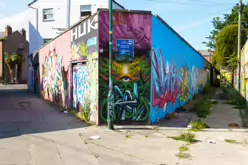 ST PETERS LANE IN PHIBSBOROUGH [BACK IN JULY 2022 IT HOSTED SOME MURALS BUT THE QUALITY WAS IN DECLINE]-244063-1