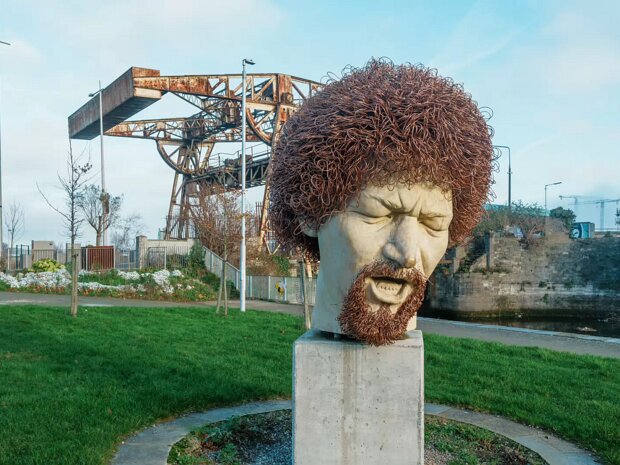LUKE KELLY When first encountering the imposing Luke Kelly sculpture on Guild Street, one might overhear, as I did, a passerby...
