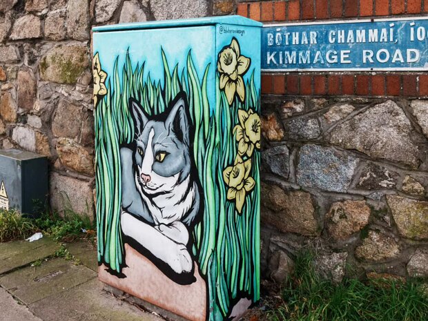 BY SHAUNA HERON This piece features a cat relaxing and surveying its kingdom from the comfort of its flower bed.