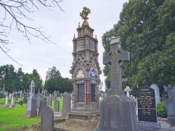 THE McCABE MEMORIAL The monument's unique design stands out amidst the more traditional headstones. It's a captivating blend of Gothic,...