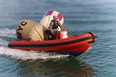 A MAN AND HIS TWO BUOYS IN A RIB [THE DMYC IN DUN LAOGHAIRE]-269716