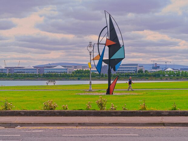 WIND SAIL SCULPTURE As you stroll along the promenade, you'll encounter the striking "Wind Sail Sculpture", created by Derry-born artist...