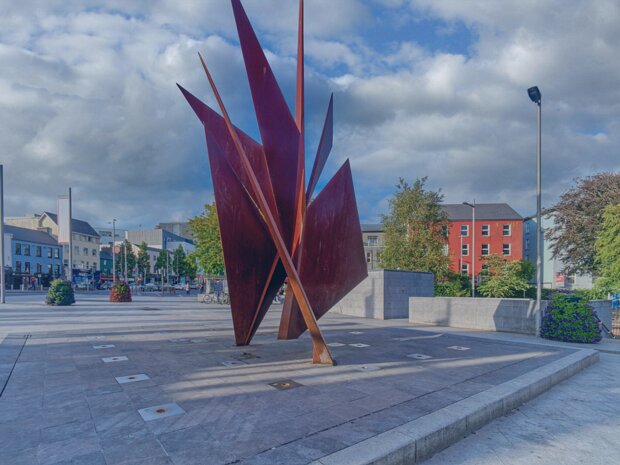 BY EAMONN O'DOHERTY This striking Corten steel sculpture, known as the Quincentennial Sails, was created by Irish artist Éamonn O'Doherty....
