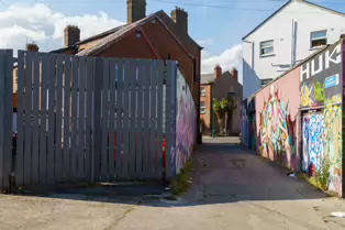 ST PETERS LANE IN PHIBSBOROUGH [BACK IN JULY 2022 IT HOSTED SOME MURALS BUT THE QUALITY WAS IN DECLINE]-244060-1
