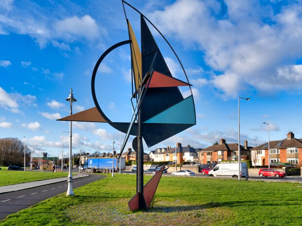 DYNAMIC WIND SCULPTURE This striking wind sculpture by Éamonn O'Doherty dominates the promenade in Clontarf, Dublin. Its kinetic energy and...