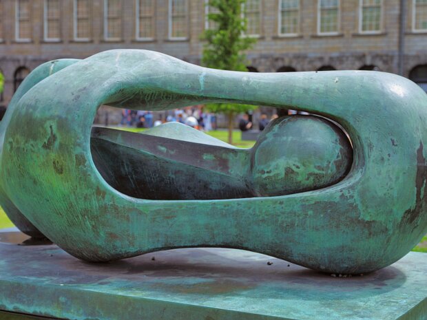 SCULPTURE BY HENRY MOORE Henry Moore's bronze sculpture, "Reclining Connected Form," created in 1969, holds a prominent position in Library...