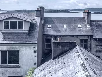 ROOFTOPS OF COBH Cobh's unique topography and the age of its buildings contribute significantly to the difficulties of maintaining its...