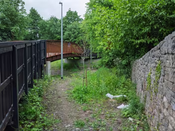 ROSEHILL BRIDGE AT COOTE'S LANE IN KILKENNY River Crossing: The bridge gracefully spans the River Breagagh, a tributary of the River Nore, within Kilkenny City.