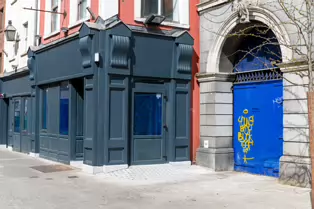 AT LONG LAST THE BUILDING HAS BEEN RESTORED [DROP DEAD TWICE WAS DESTROYED IN A FIRE IN 2022]-249581-1