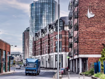 DERELICT ON DOCK ROAD Looking down Dock Road towards the towering Riverpoint building, the prominent red-brick structure on the corner of...