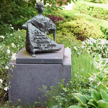 RECLINING FIGURE This striking bronze sculpture, "Reclining Figure", by Frederick Edward McWilliam (1909-1992), was relocated in 2013...