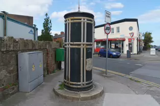 A FREESTANDING FINIAL-TOPPED CAST-IRON TRANSFORMER [DATING FROM 1900 AND LOCATED AT CONQUER HILL ROAD NEAR CLONTARF BUS GARAGE]-244413-1