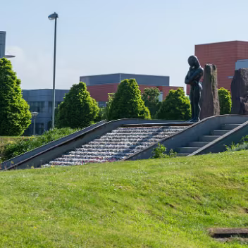 SCULPTURE BY ORLA DE BRI This striking sculpture, "The Bastard Son of Sisyphus", by Orla de Brí, is located in Park West, Dublin. It offers a...