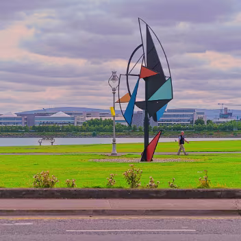 WIND SAIL SCULPTURE As you stroll along the promenade, you'll encounter the striking "Wind Sail Sculpture", created by Derry-born artist...