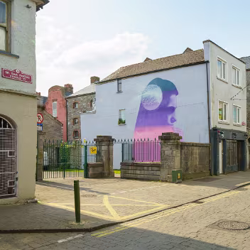 STRENGTH IN FRAGILITY The Mural: EMIC's mural is a vibrant and poignant depiction of hope and solidarity. It portrays individuals supporting...