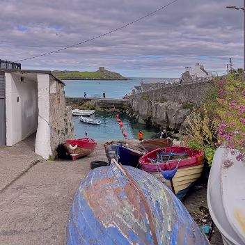 COLIEMORE HARBOUR JULY 2022 Coliemore Harbour is a small, historic harbour that has served as a vital hub for the local community for centuries....