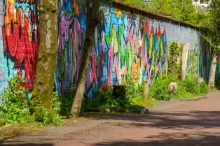 A LINEAR GALLERY OF STREET ART [ON FERRY WALK LEADING TO THE SHAKEY BRIDGE]-247708-1