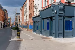 AT LONG LAST THE BUILDING HAS BEEN RESTORED [DROP DEAD TWICE WAS DESTROYED IN A FIRE IN 2022]-249582-1