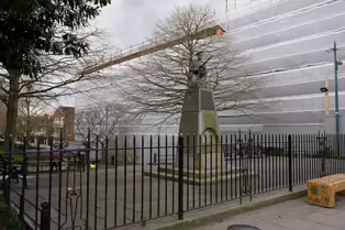 IRISH VOLUNTEERS MEMORIAL AT BLAQUIERE BRIDGE AND THE OLD STATE CINEMA [THE ORIGINAL RIFLE WAS BRONZE RATHER THAN STONE]-250149-1