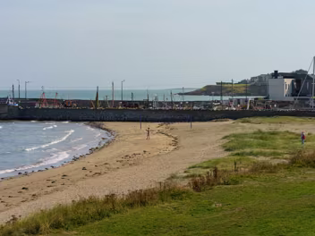 THE FRONT STRAND The beach's main features include its vast expanse of golden sand, perfect for sunbathing, picnicking, and leisurely...