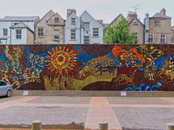 HAS BEEN DEMOLISHED The Táin Wall, created in 1974, stood as a testament to Kinney's artistic vision and his deep appreciation for Irish...
