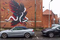 EXAMPLES OF STREET ART BY DANK AND SABEK [ON THE RED BRICK WALL ON TALBOT STREET IN BELFAST]-235444-1 MURAL ON TALBOT STREET