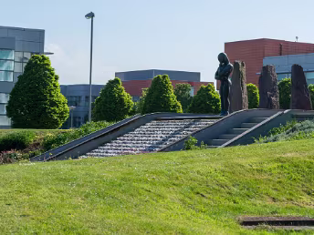 SCULPTURE BY ORLA DE BRI This striking sculpture, "The Bastard Son of Sisyphus", by Orla de Brí, is located in Park West, Dublin. It offers a...